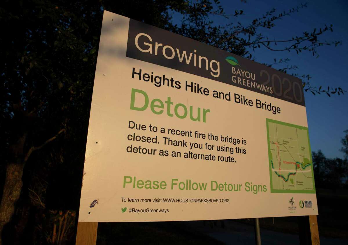 A sign notifying people to make a detour from M-K-T Trail to White Oak Bayou Trail is placed at the junction before M-K-T Bridge Wednesday, Dec. 16, 2020, at in Houston.