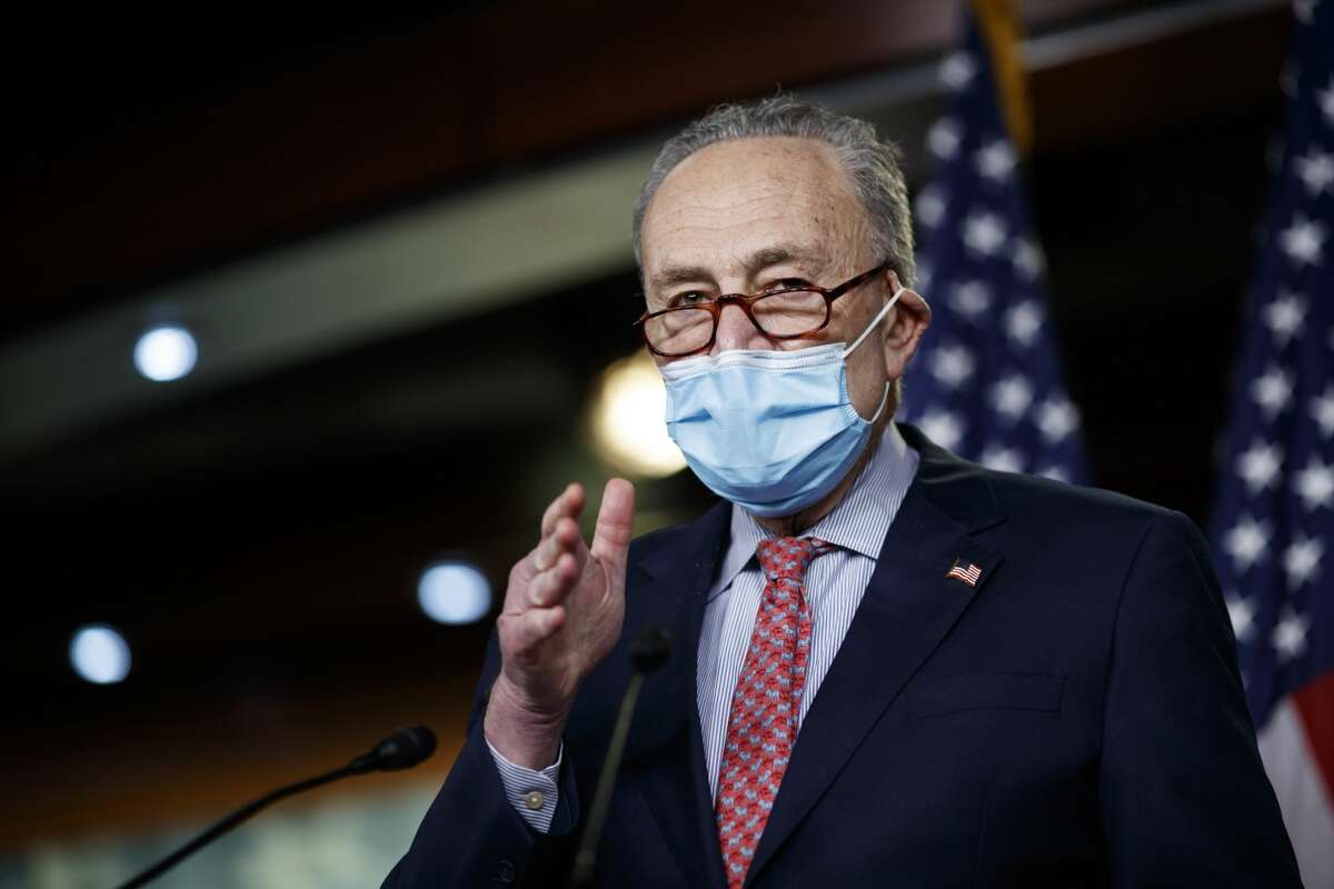Senate Minority Leader Chuck Schumer, a Democrat from New York, wears a protective mask while speaking during a news conference at the U.S. Capitol Building in Washington, D.C., U.S., on Sunday, Dec. 20, 2020. Congressional leaders reached a deal on a roughly $900 billion spending package to bolster the U.S. economy amid the continued coronavirus pandemic giving lawmakers a short timetable to review and pass the second largest economic-rescue measure in the nation's history. Photographer: Ting Shen/Bloomberg