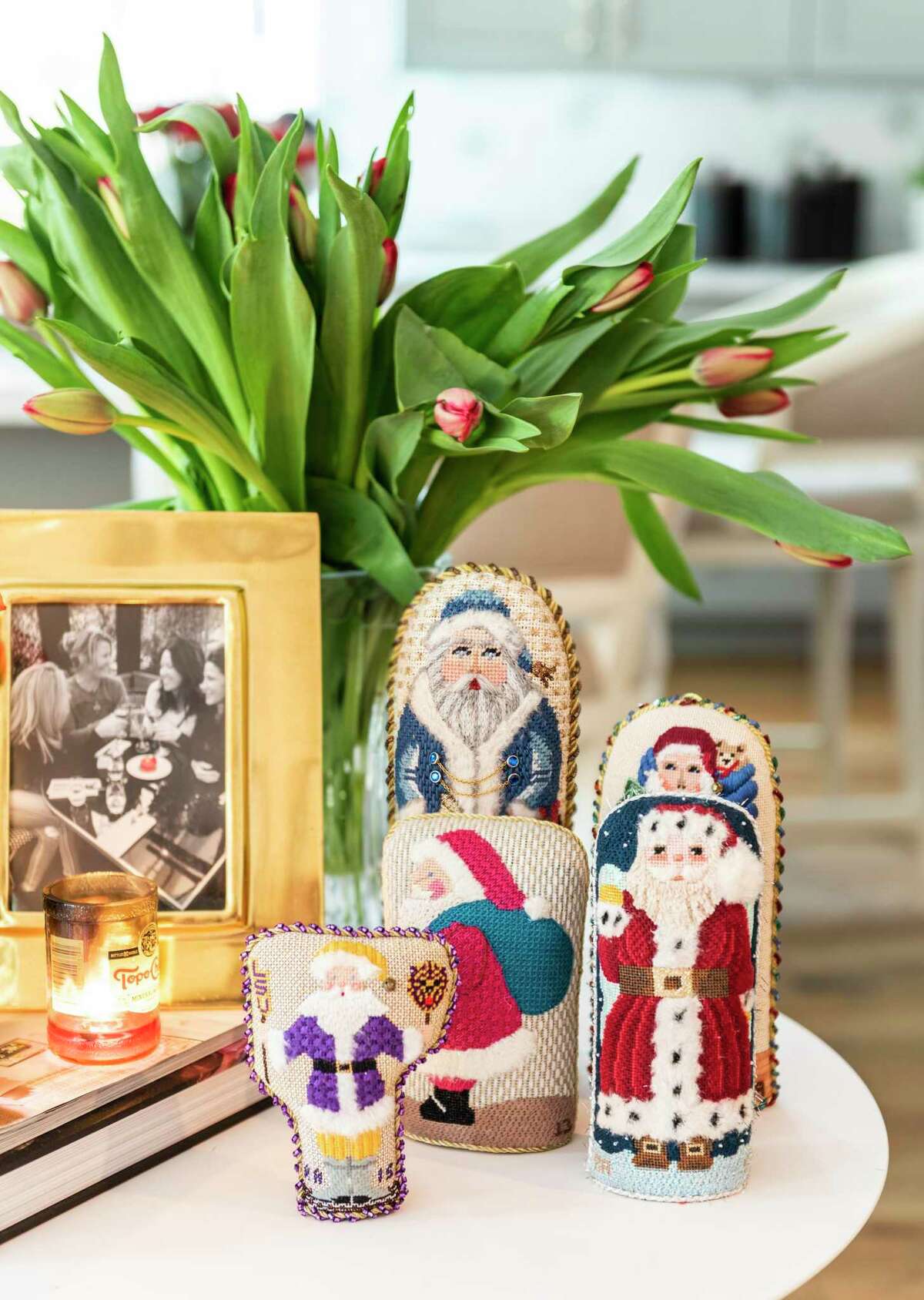 These cute needlepoint figures sit on a side table.