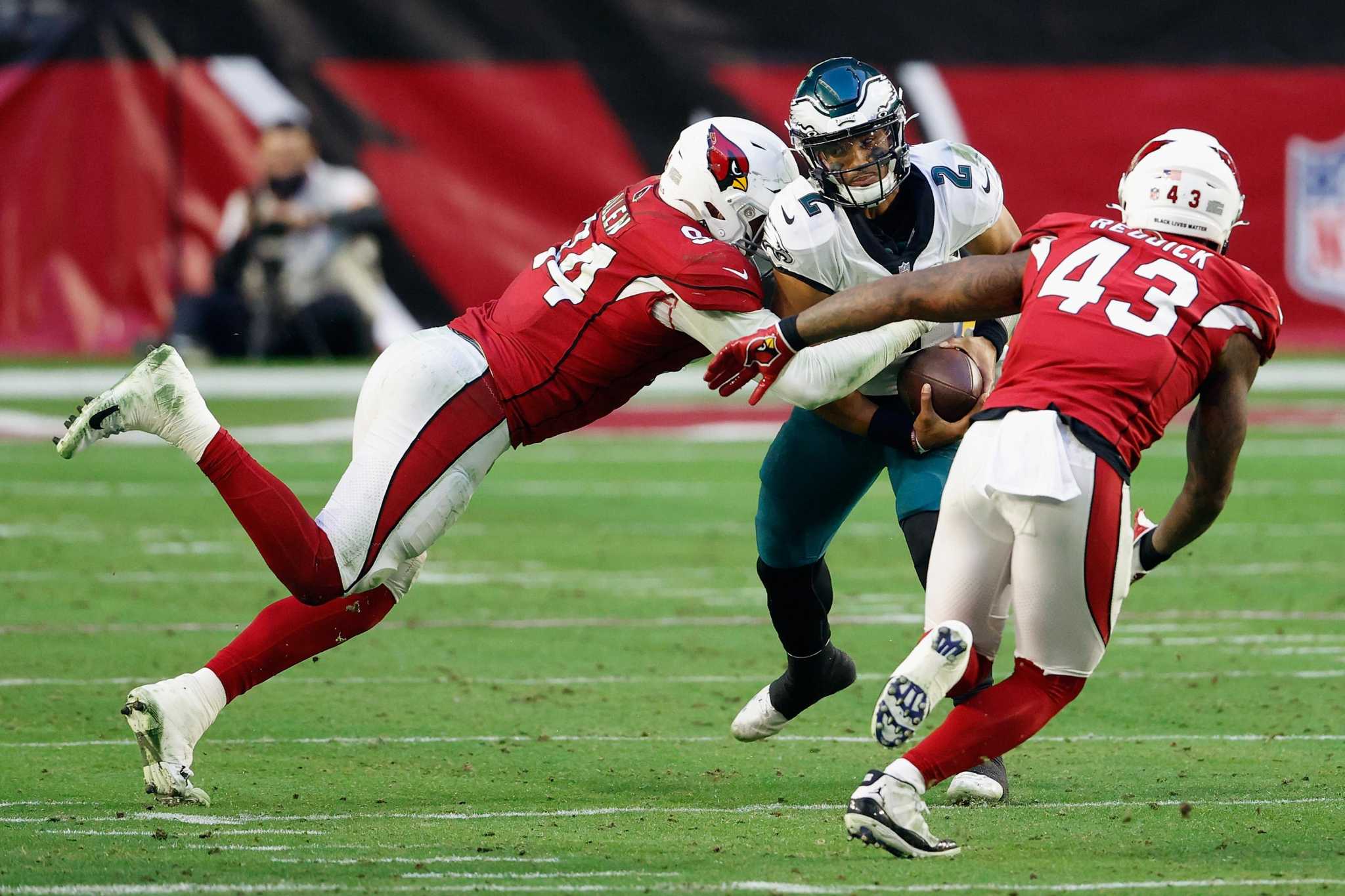 Murray, Hopkins lead Cardinals past Eagles 33-26