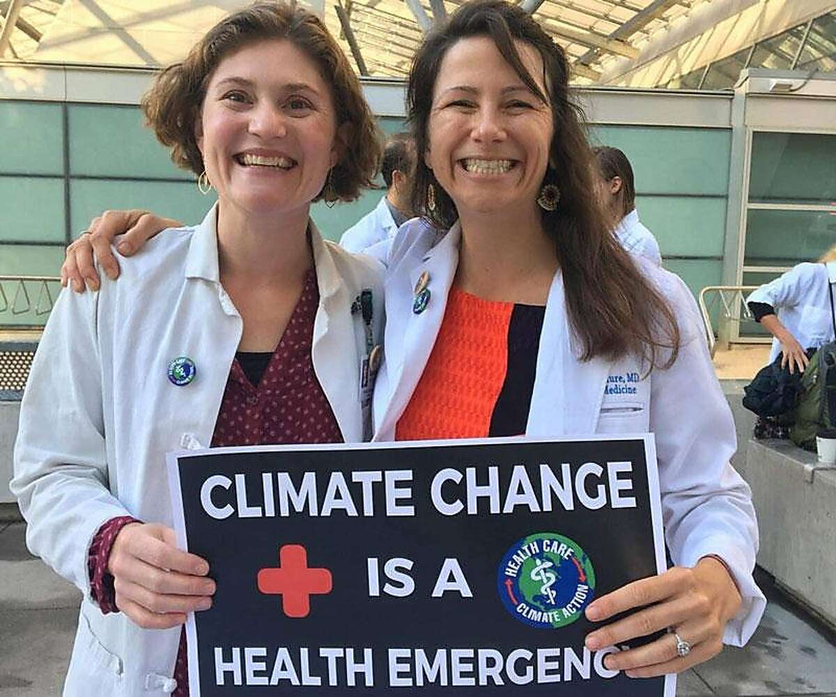 Dr. Amanda Millstein (left) and Dr. Ashley McClure participate in the 2019 Youth Climate Strike march, Sept. 20, 2019 in San Francisco.