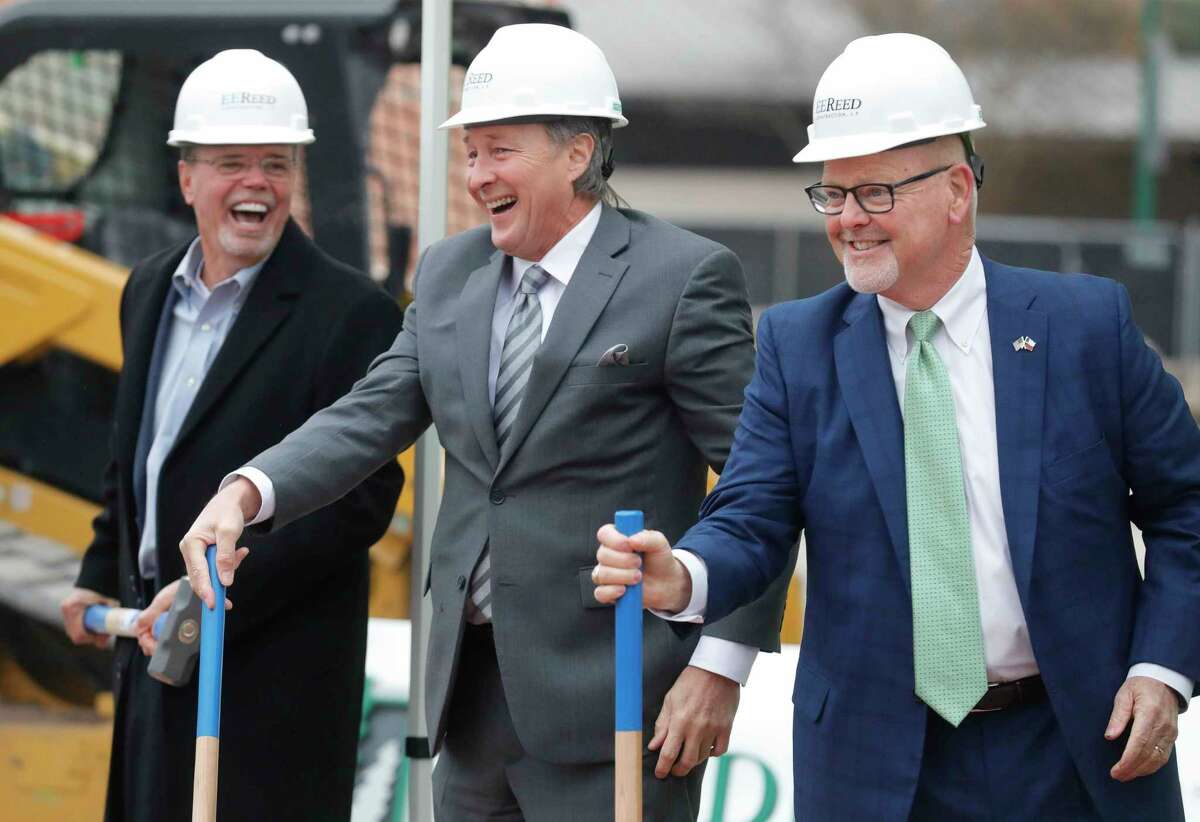 Woodforest Bank president and CEO Jay Dreibelbis, right, shares a laugh beside Conroe Mayor Pro Tem Raymond McDonald, center, and Robert Marling, Woodforest Bank founder and chairman, during a groundbreaking ceremony for a new Woodforest Bank building along West Davis Drive, Tuesday, Dec. 15, 2020, in Conroe.