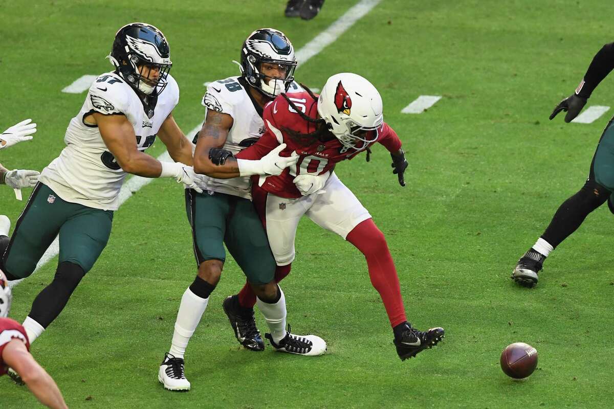 GLENDALE, ARIZONA - DECEMBER 20: DeAndre Hopkins #10 of the Arizona Cardinals attempts to get the ball back after a first quarter fumble against Michael Jacquet #38 of the Philadelphia Eagles at State Farm Stadium on December 20, 2020 in Glendale, Arizona. (Photo by Norm Hall/Getty Images)