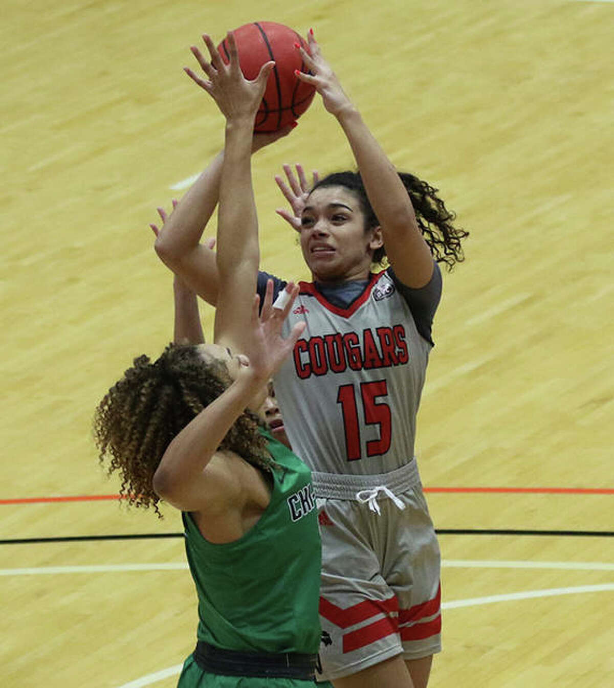 SIUE’s Masyn McWilliams (15) pulls up and shoot over a Chicago State defender in the lane Monday at First Community Arena in Edwardsville.