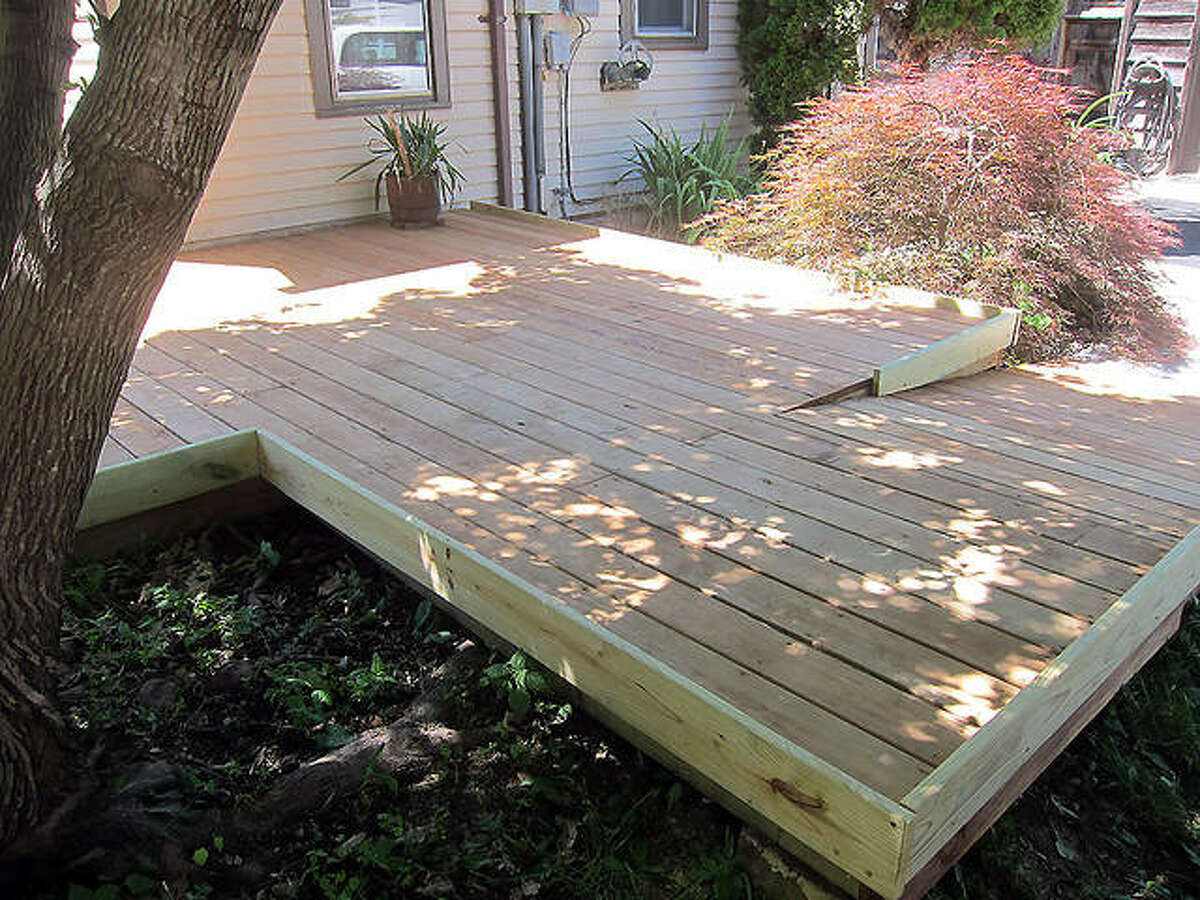 This is the “after” picture of a project that Rebuilding Together Southwest Illinois did this year for a homeowner to repair his deck and build two ramps, so he has a safe way out of his house.