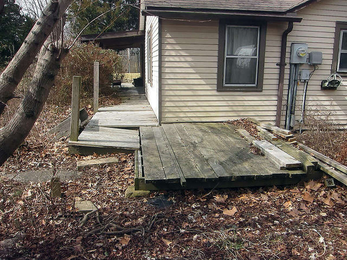 This is the “before” picture of a project that Rebuilding Together Southwest Illinois did this year for a homeowner to repair his deck and build two ramps, so he has a safe way out of his house.