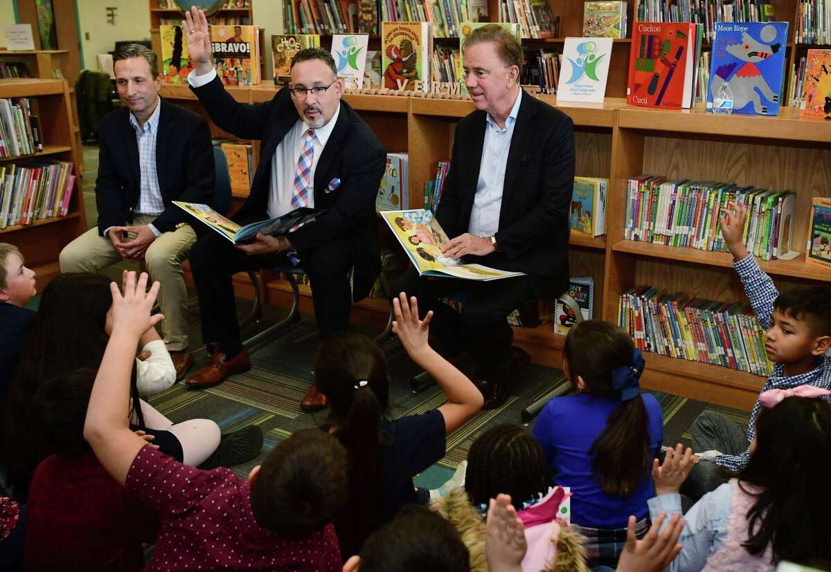 State Senate Majority Leader Bob Duff, State Department of Education Commissioner Miguel Cardona and Governor Ned Lamont visit Silvermine Dual Language Magnet School on February 28, 2020, to read to students in recognition of Read Across America at the school in Norwalk. Connecticut Cardona is President-elect Joe Biden’s pick for U.S. secretary of education.