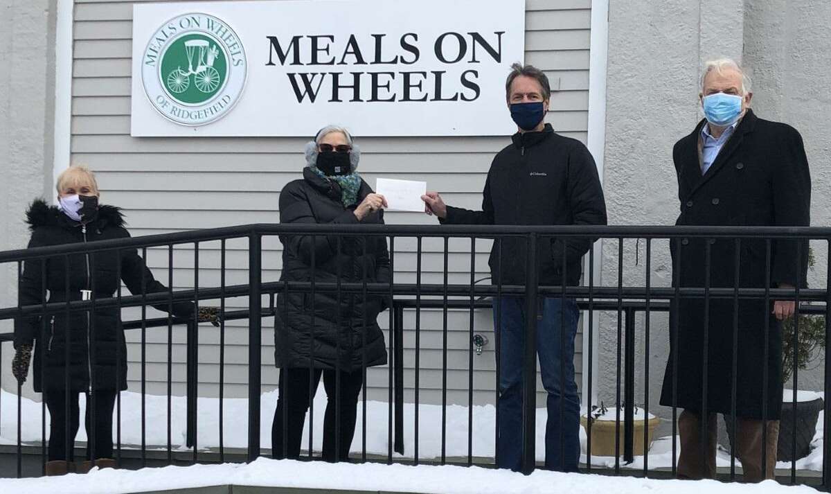 This presentation was done on Friday Dec. 18 with great care taken to abide by COVID-19 prevention guidelines. In the center, Susie Singer, an Exchange Club of Ridgefield member and the project leader for this effort, hands the checks collected to Meals on Wheels of Ridgefield Board Chair Dean Miller with support from Nick Percival (right), Exchange Club of Ridgefield President, and Dyane MacDaniel (left), Meals on Wheels President Emeritus and Exchange Club member.