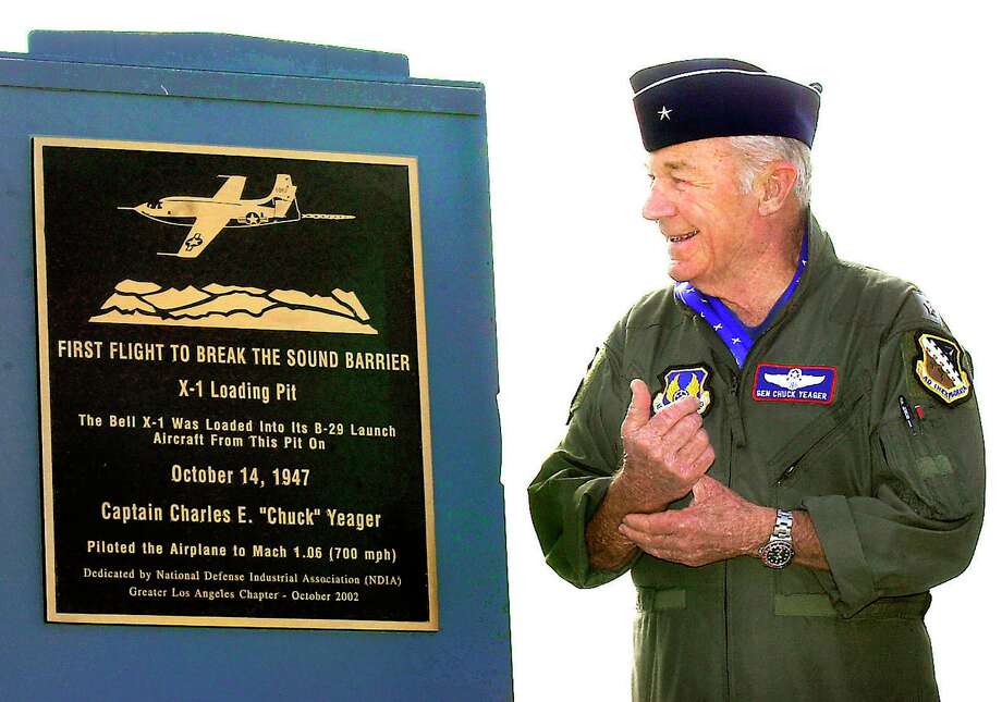 In this 2002 photo, retired Air Force Brig. Gen. Yeager receives a plaque from the National Defense Industrial Association, recognizing his breaking of the sound barrier and the use of X- 1 loading pit. Photo: Ron Siddle, MBR / Associated Press / AP2002