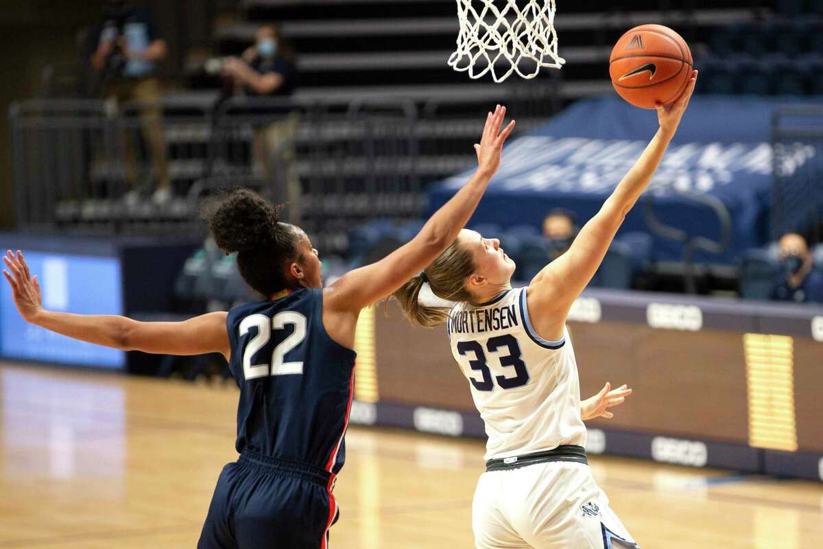 HARTFORD, CT - FEBRUARY 09: UConn Huskies guard Evina Westbrook (22)  defended by Villanova Wildcats forward Maddy Siegrist (20) during a college  basketball game between Villanova Wildcats and UConn Huskies on February