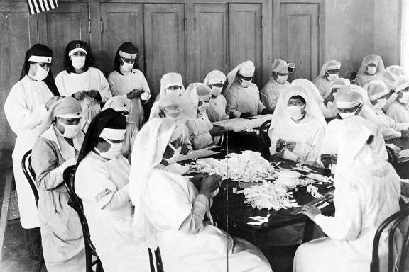 1918: Volunteers in Oakland sew masks to prevent the spread of the flu, during the deadly Spanish influenza of 1918 and 1919.