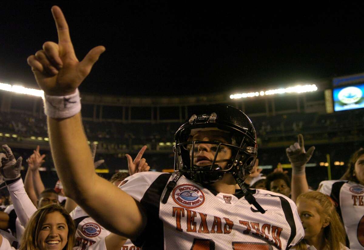 Texas Tech quarterback Sonny Cumbie celebrates 45-31 victory over Cal in the Pacific Life Holiday Bowl at Qualcomm Stadium in San Diego, Calif. on Thursday, Dec. 30, 2004. Cumbie was 39 of 60 for a career-high 520 yards and three touchdowns to lead the No. 23 Red Raiders to an upset of No. 4 Cal. (Photo by Kirby Lee/Getty Images)