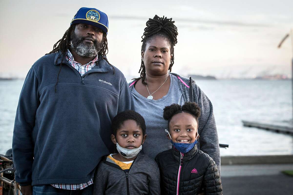 Lisa Reed, with her husband, Chris, daughter, Arissa, 8, and son Alonzo, 6, at the Berkeley Marina. Reed this week received word that she will be laid off January 4 from her job as a driver for Golden Gate Transit due to the COVID-19 pandemic and lack of riders on public transportation.