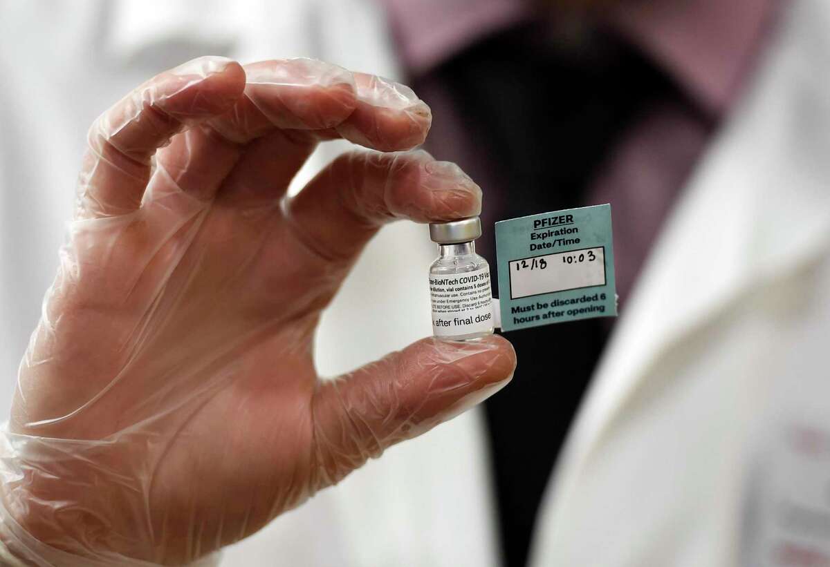 A file photo of a vial of the Pfizer vaccine, taken on Friday, Dec. 18, 2020, in West Hartford, Conn.