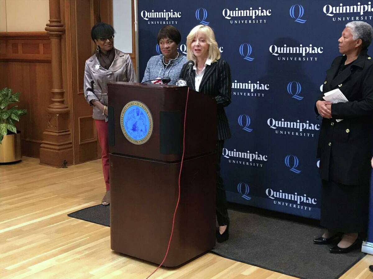 In this file photo, Quinnipiac University President Judy Olian announces a partnership between the university and the New Haven Promise on Oct. 16, 2019.