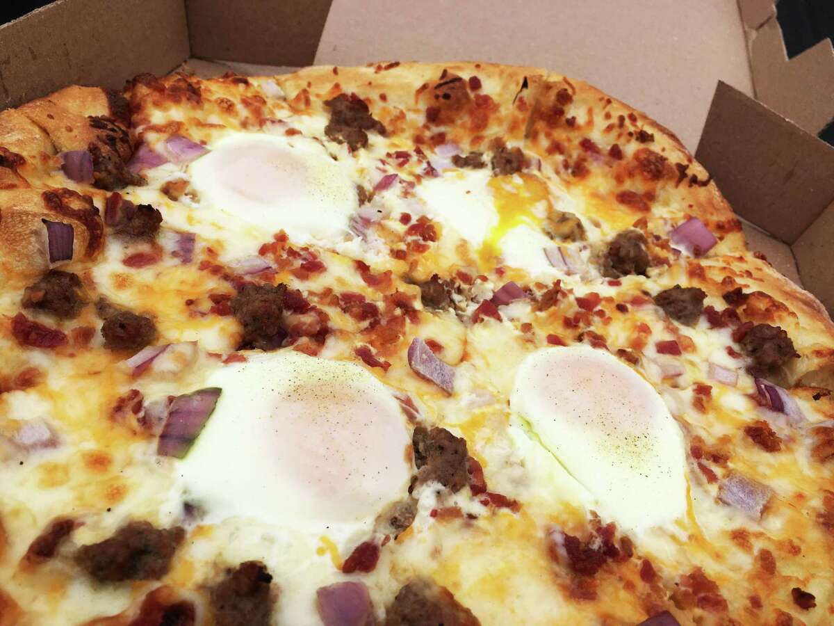 You could find the Big Over Easy Pizza with eggs at Broken Stone when it was open.