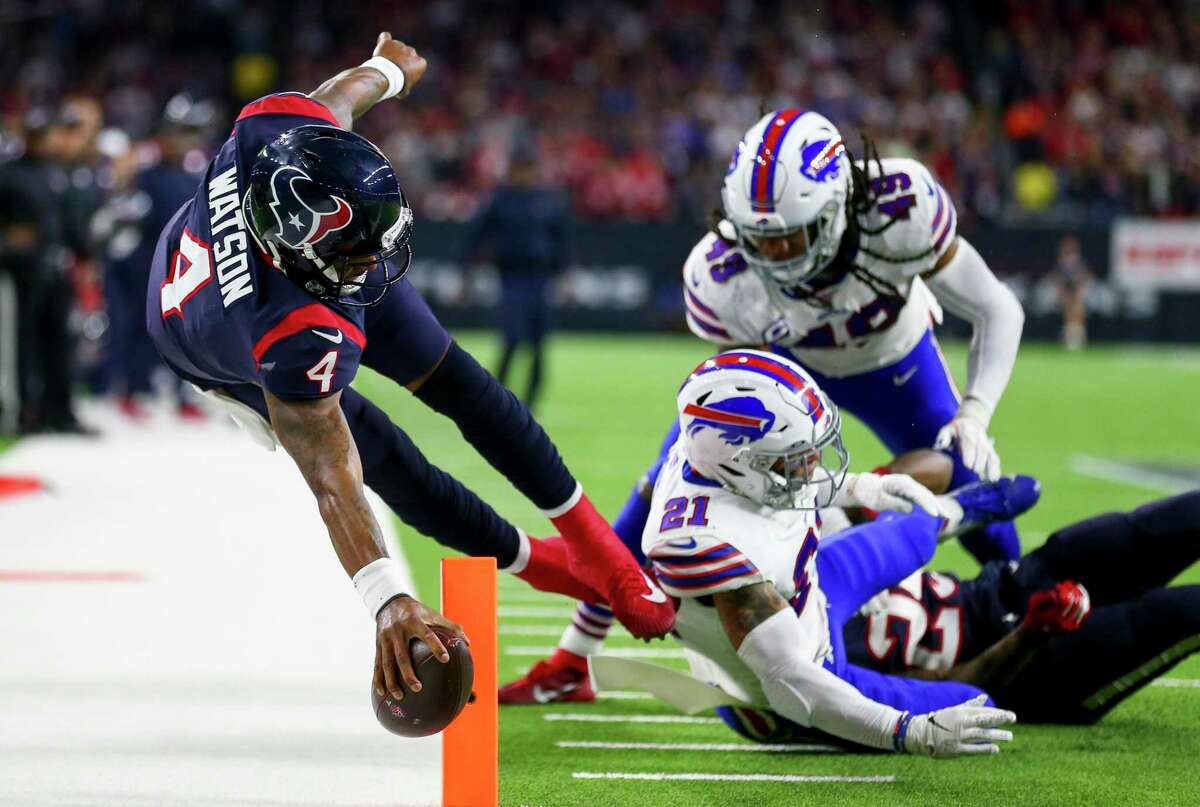 Houston Texans quarterback Deshaun Watson (4) stretches the ball across the goal line to get a two-point conversion against the Buffalo Bills during the third quarter of an AFC Wild Card playoff game at NRG Stadium Saturday, Jan. 4, 2020, in Houston.