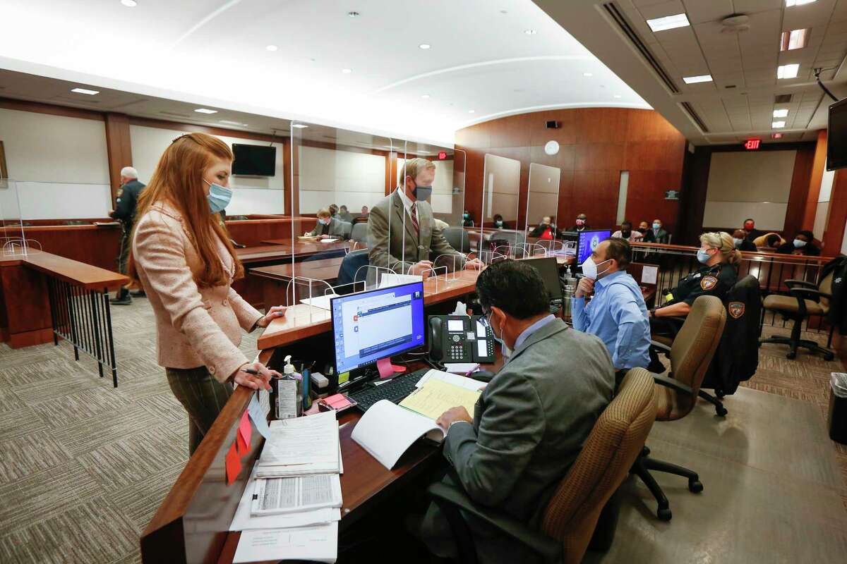 Safety protocol and Zoom hearings are being used in Judge Josh Hill's courtroom in the Harris County Criminal Justice Center 232nd Criminal Court Wednesday, Dec. 16, 2020, in Houston.