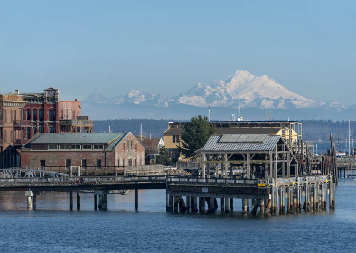 #99. Port Townsend, Washington - Population: 9,428 - Median home value: $308,600 (59% own) - Median rent: $953 (41% rent) - Median household income: $52,000 History and nature abound in Port Townsend, a city on the Quimper Peninsula in Washington. The Port Townsend Historic District is a U.S. National Historic Landmark District, and the town has prime real estate near the Olympic Mountains.