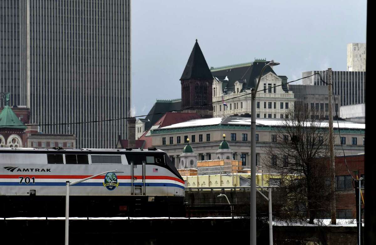 Am Amtrak train heads west through the city on Thursday, Dec. 24, 2020, in Albany, N.Y. (Will Waldron/Times Union)