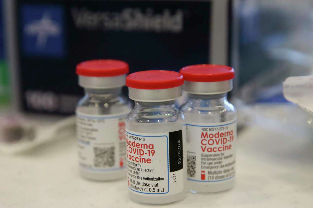 Medical staff prepare doses of the Moderna COVID-19 vaccine.