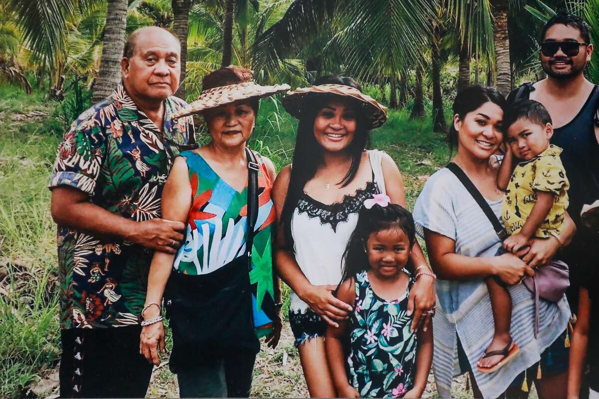 A family photograph includes Jesus Baluyot (left), the husband of Mariquita Baluyot and father of Jenilee Silva and Jasmine Igtanloc.