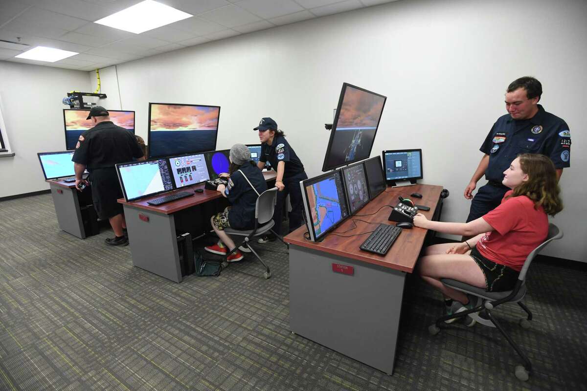 Sea Scouts members learn about operating ships on simulators at Lamar Orange on Thursday. Lamar celebrated the maritime industry as part of the school's 50th anniversary. Photo taken Wednesday, 7/17/19