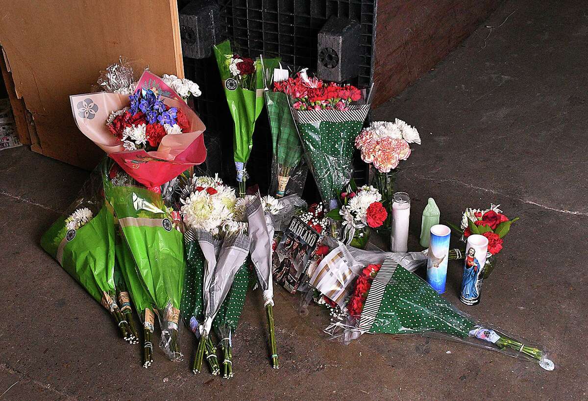 Floral bouquets, LED candles, a basket filled with Christmas treats and a DVD of one of his favorite movies mark the scene where longtime LMT employee Jose Homero Gonzalez Jr. lost his life.
