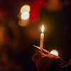 Redemption Church in downtown Beaumont held a candlelight service to celebrate Christmas Eve and the birth of the Christ child. The service included signing hymns and Christmas carols to start and end the service, with Pastor Byron Ellis reading from the Christmas story and preaching a message about "God With Us" with the birth of Christ. The congregation closed the service by lighting candles and singing together. Photo made on December 24, 2020. Fran Ruchalski/The Enterprise