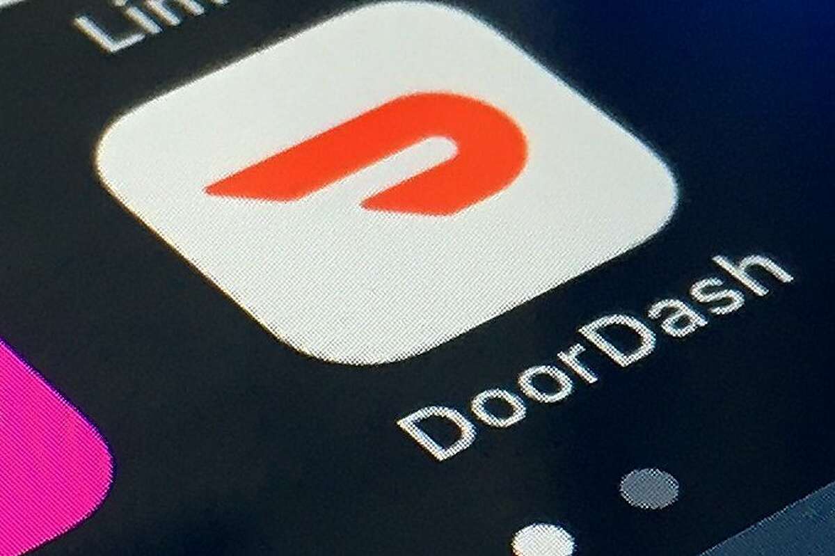 The DoorDash app is shown on a smartphone. DoorDash is now delivering same-day coronavirus test kits, the company said Monday. But they will not be accessible for Bay Area residents.