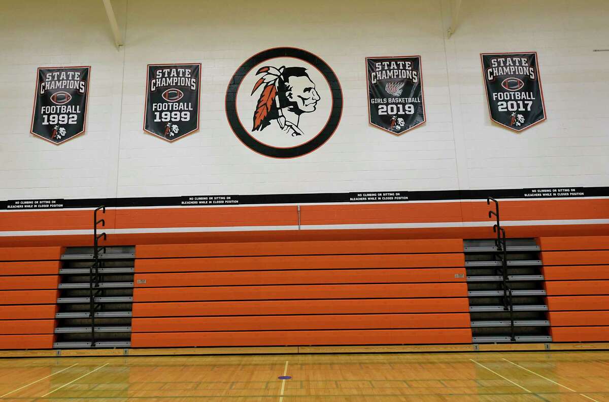 Championship banners are seen on a wall in the gymnasium at Cambridge High School, with the mascot in the center. The state Supreme Court is expected to rule soon on whether the mascot must be removed. (Lori Van Buren/Times Union)