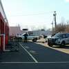 Orange police investigate a fatal shooting at Town Fair Tire in Orange, Conn., on Saturday Dec. 26, 2020.