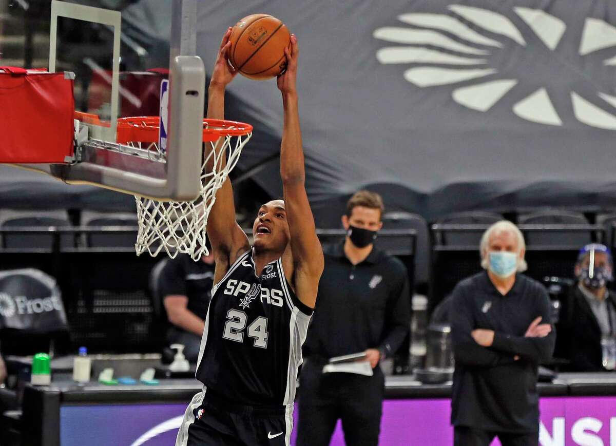 San Antonio Spurs guard Devin Vassell (24) dunks against the Raptors. Spurs v Raptors at AT&T Center on Saturday, Dec. 26, 2020.