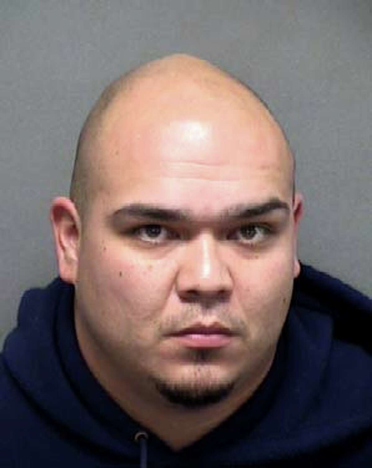 John Paul Garza, 31, seen in a Monday, Dec. 28, 2020 booking photo provided Dec. 28 by the Bexar County Sheriff's Office, was charged with continuous violence against family and violation of a protective order for allegedly physically assaulting his girlfriend according to Sheriff Salazar. This is the second time this year Garza has been arrested on family violence charges.