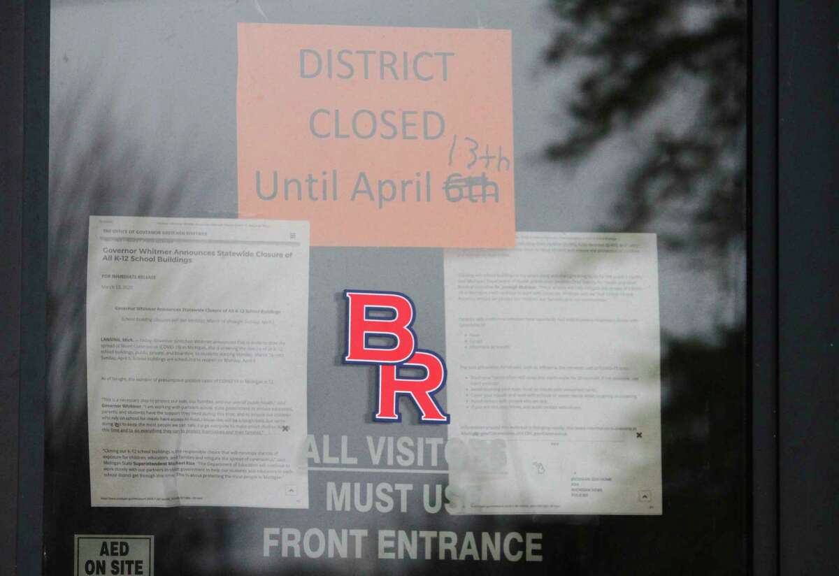 A sign posted on the door at Riverview Elementary School in Big Rapids in April indicates the school's closure. While the closure was initially extended until April 13, it was once again extended through the remainder of the year. (Pioneer file photo)