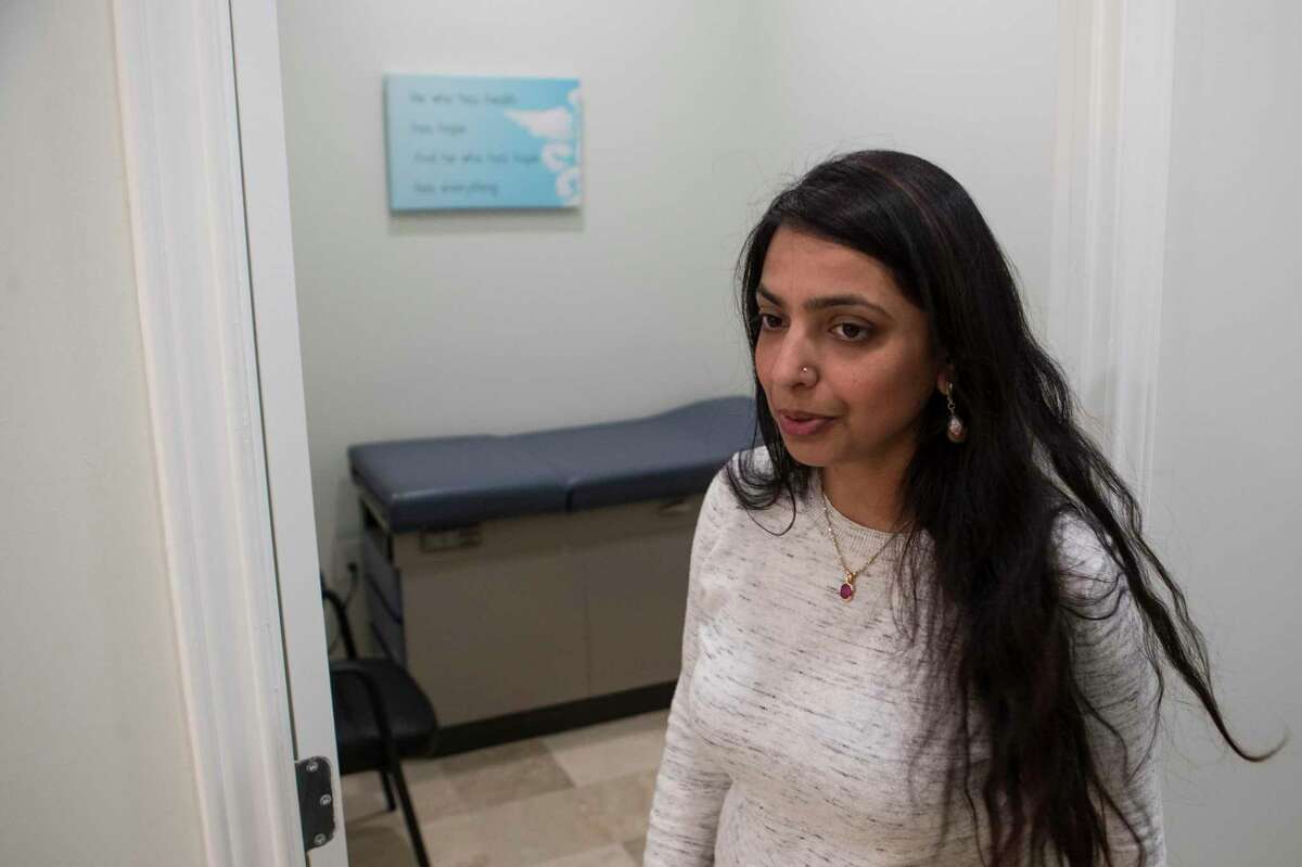 Deepika Agarwal takes a tour inside the new clinic in the Bella Vista apartments Thursday, Dec. 10, 2020 in Houston. Nitya is adding a clinic to the apartment complex, which will be "completely free" for its renters starting in January, after gaining approval by the Texas Medical Board.