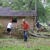 Father Ron Foshage is cleaning up debris caused by Hurricane Laura with the help of players and coaches from the Jasper High football team in Jasper, TX.