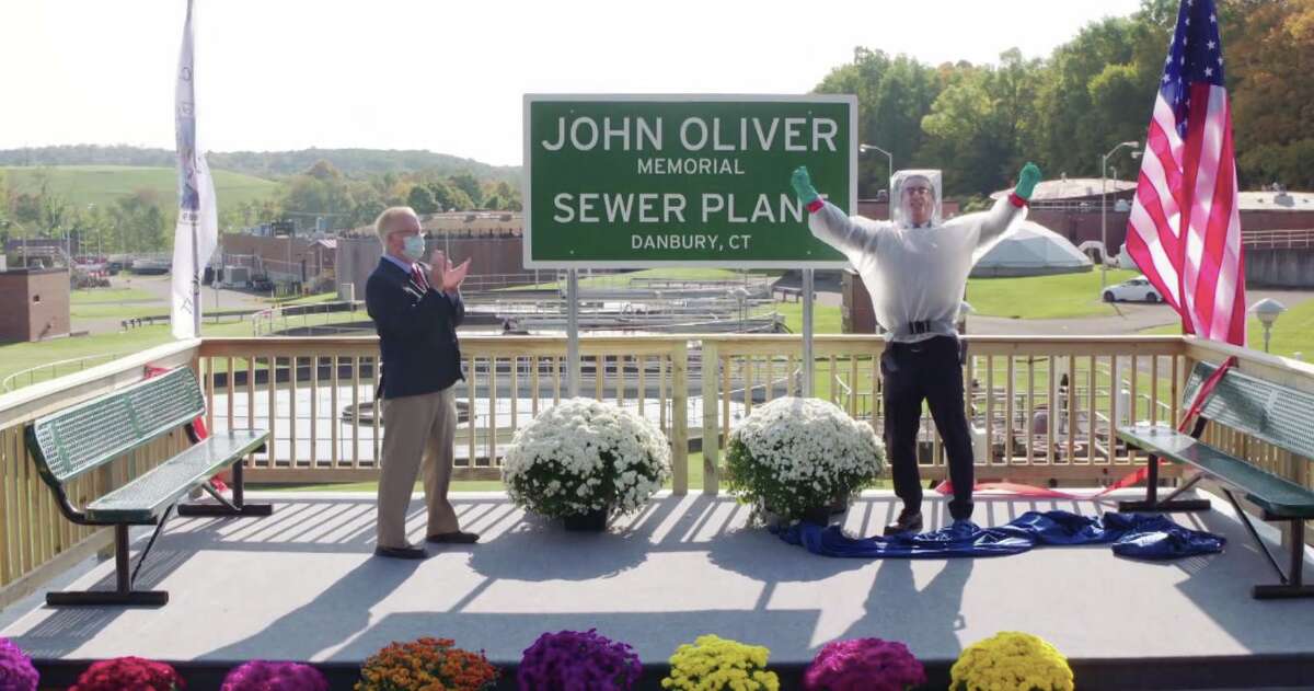 HBO comedian John Oliver and Danbury Mayor Mark celebrate after the ribbon is cut at the newly named "John Oliver Memorial Sewer Plant."