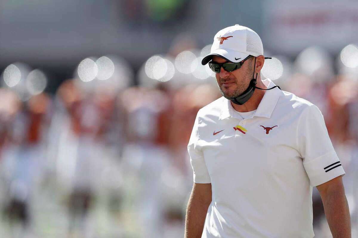 AUSTIN, TEXAS - NOVEMBER 07: Head coach Tom Herman of the Texas Longhorns watches players warm up before the game against the West Virginia Mountaineers at Darrell K Royal-Texas Memorial Stadium on November 07, 2020 in Austin, Texas. (Photo by Tim Warner/Getty Images)