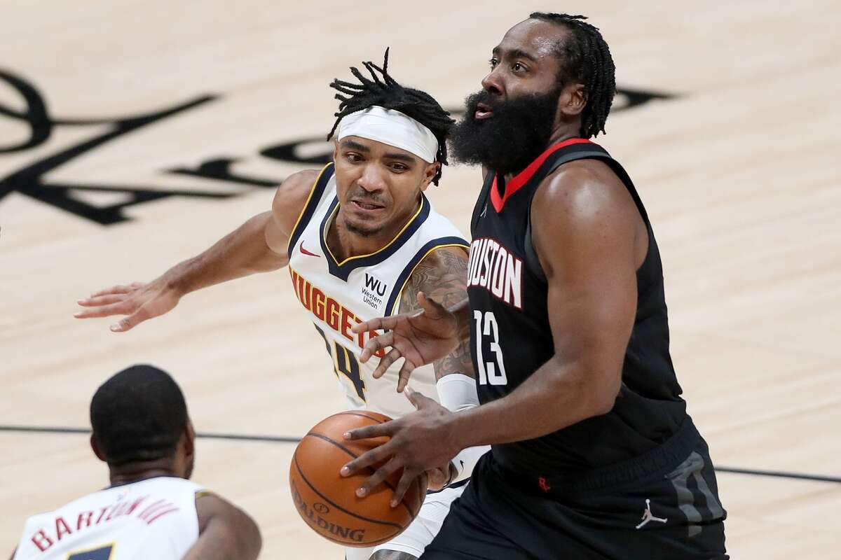DENVER, COLORADO - DECEMBER 28: James Harden #13 of the Houston Rockets drives to the basket against Gary Harris #14 of the Denver Nuggets in the third quarter at Ball Arena on December 28, 2020 in Denver, Colorado. NOTE TO USER: User expressly acknowledges and agrees that, by downloading and or using this photograph, User is consenting to the terms and conditions of the Getty Images License Agreement. (Photo by Matthew Stockman/Getty Images)