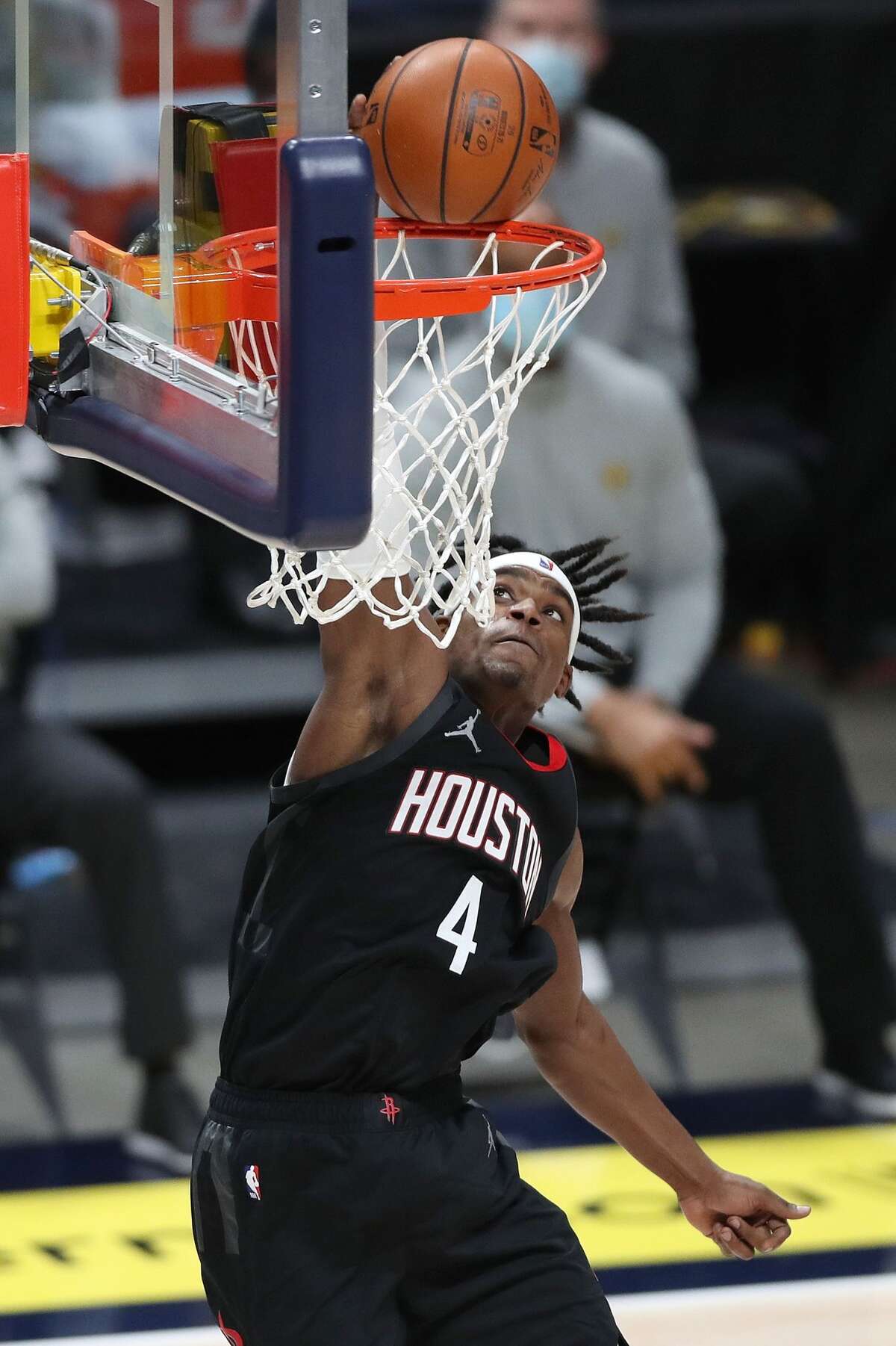 DENVER, COLORADO - DECEMBER 28: Danuel House Jr #4 of the Houston Rockets dunks against the Denver Nuggets in the third quarter at Ball Arena on December 28, 2020 in Denver, Colorado. NOTE TO USER: User expressly acknowledges and agrees that, by downloading and or using this photograph, User is consenting to the terms and conditions of the Getty Images License Agreement. (Photo by Matthew Stockman/Getty Images)