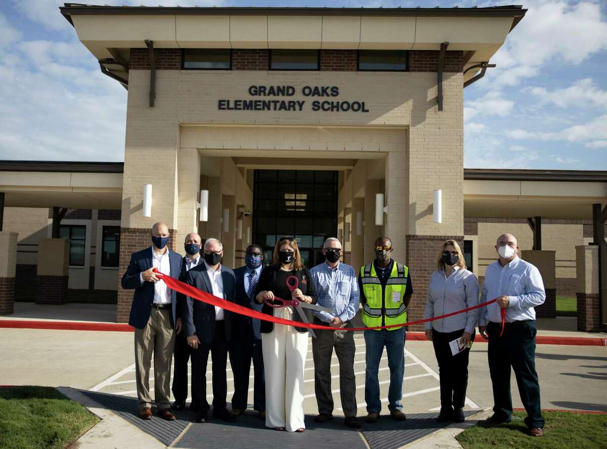 The construction team along with Tomball ISD superintendent Dr. Martha Salazar-Zamora pose for a portrait during a ribbon cutting held at Grand Oaks Elementary in Tomball, Friday, Sept. 4, 2020. The facility was funded through the Tomball ISD’s Bond 2017.