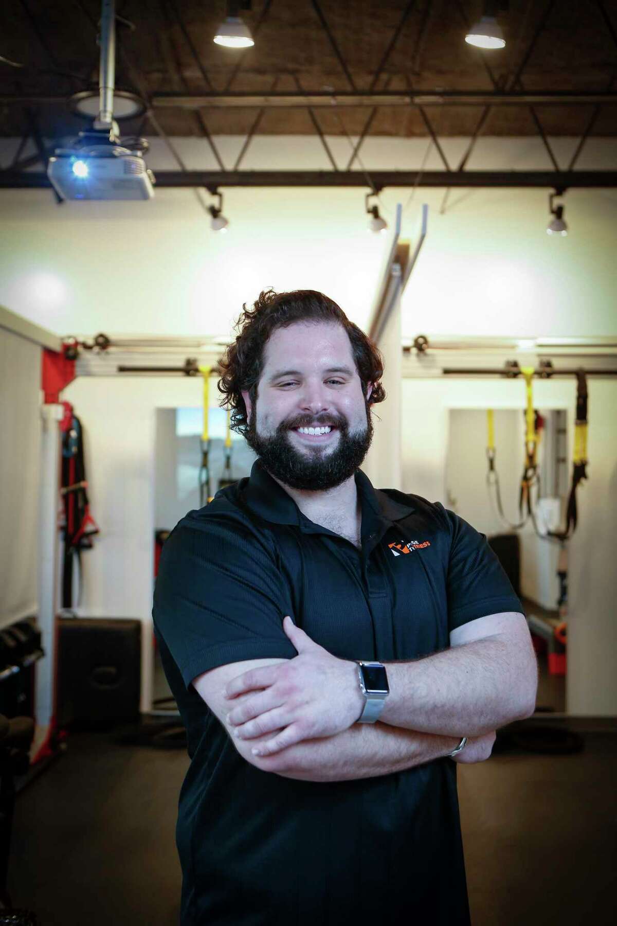 Pledge to Fitness owner, Andres Loperena poses for a photo in his boutique gym Friday, Dec. 18, 2020, in Houston.
