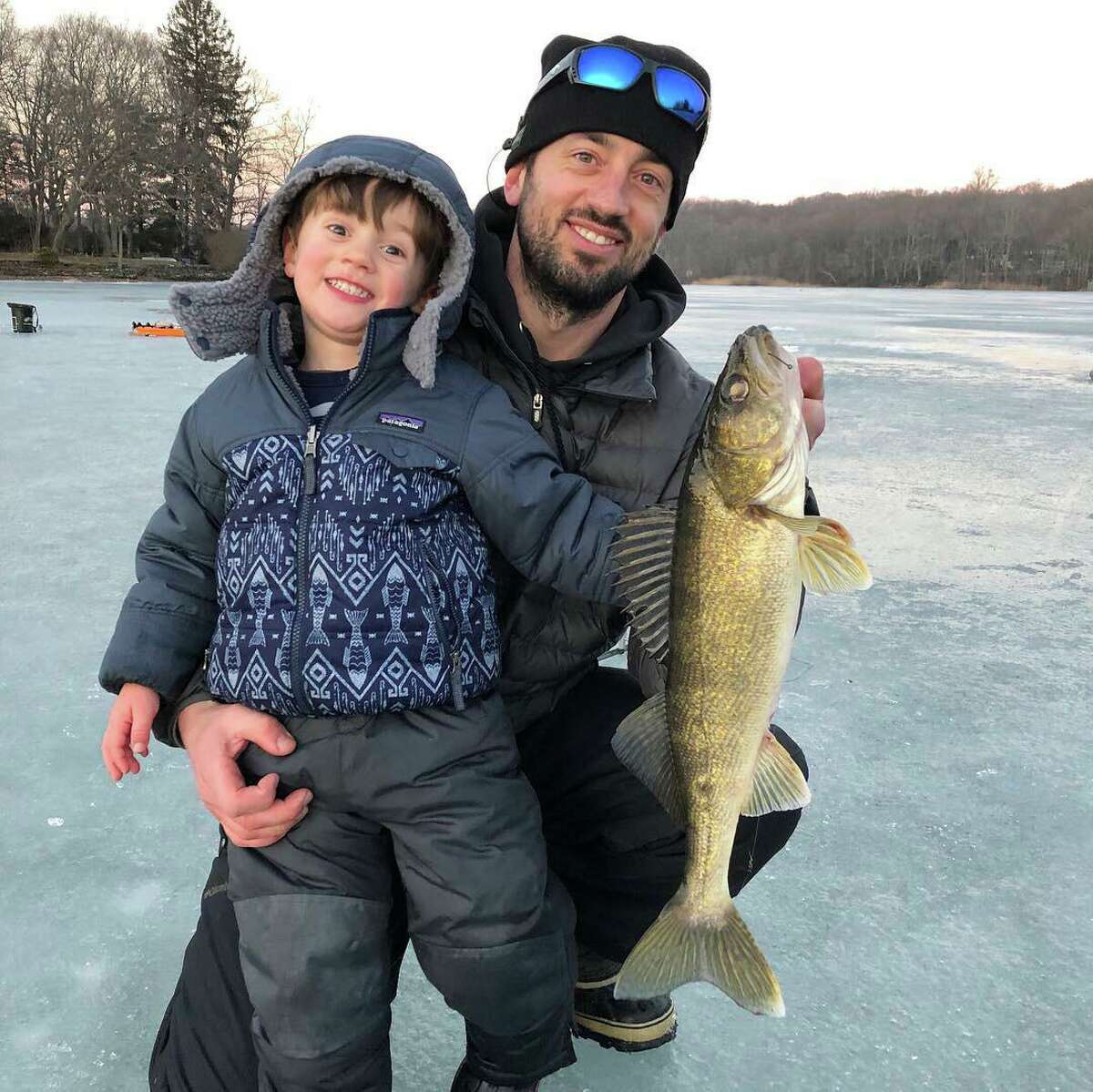 Justin Wiggins and his son, Quinn, show off a keeper walleye last February while enjoying ice fishing at Coventry Lake. Wiggins coordinates the fishing education program for Connecticut’s Department of Energy and Environmental Protection. “I went over to investigate and she had one leg down through the ice and the other bent behind her (stuck and nowhere to go as she stepped in someone else’s hole from a previous outing). I lifted her out and drove home, 1 mile, we were only on the ice about 20 minutes. It was not a deterrent and she still loves to go.” Ice fishing can be lots of fun, but if you’ve never gone before there’s some things you should know. Beauchene, a supervising fisheries biologist with the state’s Department of Energy and Environmental Protection, shared some tips via email. “Ice fishing involves walking and drilling holes as you go, so you generally know what the thickness is,” he said. “There’s not a lot of monitoring that goes on, unless it’s a place designated and used by a town for skating or such."