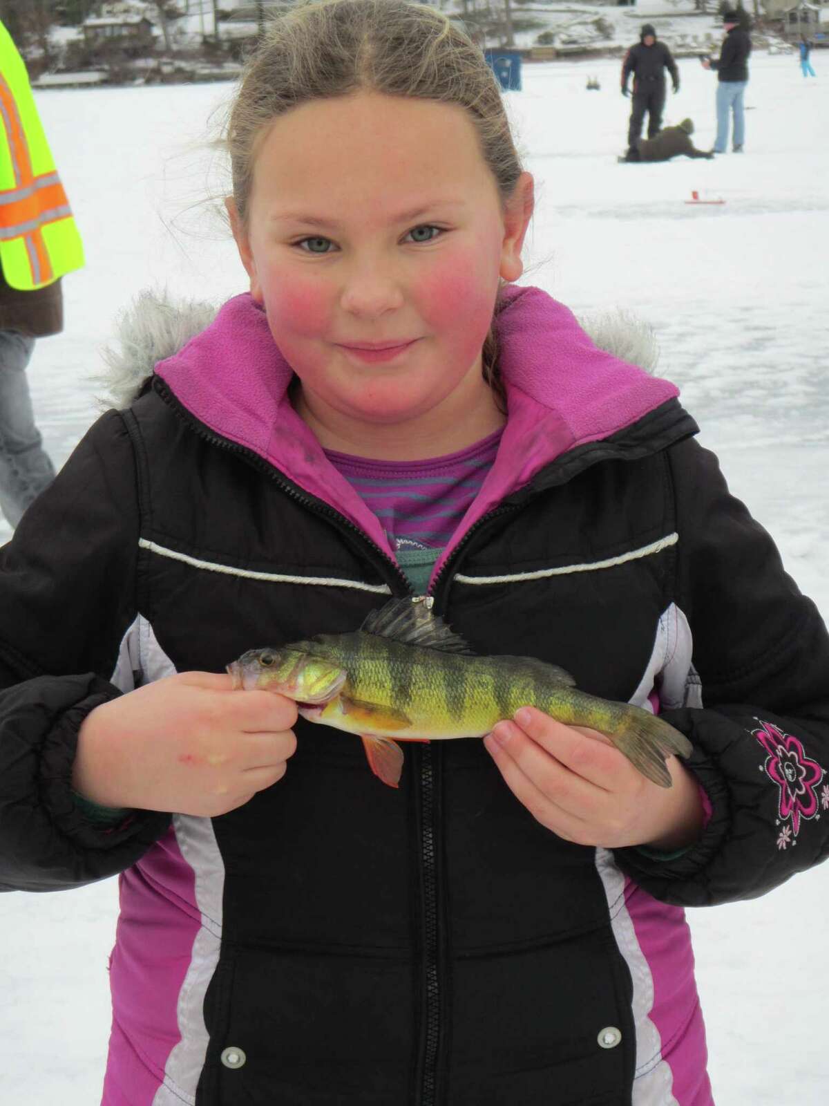 A rosy-cheeked ice angler shows off what she caught during an ice fishing event held by Connecticut’s Department of Energy and Environmental Protection. Beauchene, who lives in Barkhamsted, said ice fishing helps cure that restless feeling folks get when they’ve been cooped up inside too long. He said it’s great to be out on a beautiful winter day with family and friends, when skies are blue and the sun is warm, and you can “maybe even catch a fish.” But he warned the experience can be “unnerving for some” because ice expands as the day heats up and there are often large “booms.” They may make you think the ice is going to break, he said, but as long as you have a solid four inches or more, it will be fine. Beauchene’s best advice for first-timers is to sign up for Connecticut’s free “Learn to Ice Fish” class (via Zoom), “then come out on one of our small group personalized instruction ice fishing trips. See: https://bit.ly/3rjbwZ8.