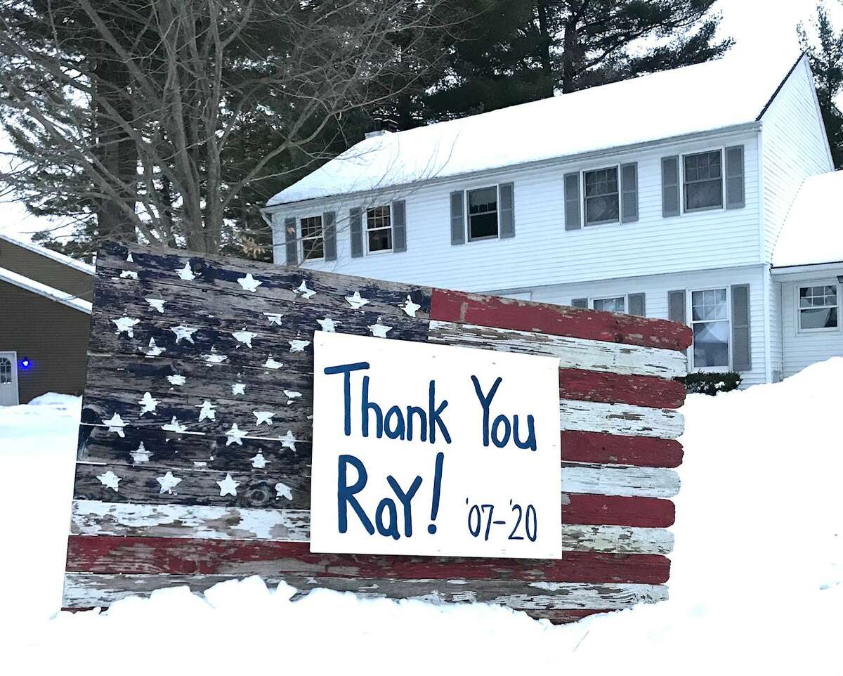 Dozens of customers along Ray Andi's mail route made homemade signs to thank him for his terrific mail service for the past 16 years in Guilderland (Paul Grondahl / Times Union)