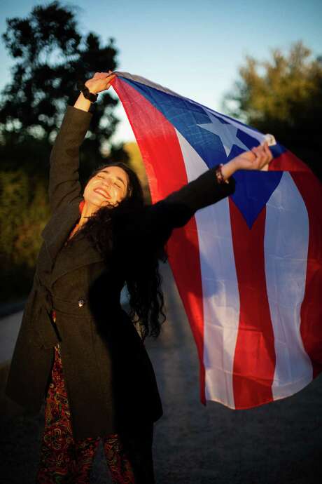 Houston-based poet Miriam Maldonado, 39, shows pride in her Puerto Rican heritage at Eleanor Tinsley Park. Now that she has recovered from COVID-19, she plans to spend Día de Reyes, or Three Kings Day, with her children in San Marcos. Photo: Marie D. De Jesús, Houston Chronicle / Staff Photographer / © 2020 Houston Chronicle