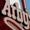 FILE - This March 1, 2010, file photo shows an Arby's restaurant sign in Cutler Bay, Fla. Arby's is buying casual dining chain Buffalo Wild Wings in a deal worth about $2.4 billion. Arby's Restaurant Group Inc. said Tuesday, Nov. 28, 2017, that it will pay $157 per share. (AP Photo/Wilfredo Lee, File)