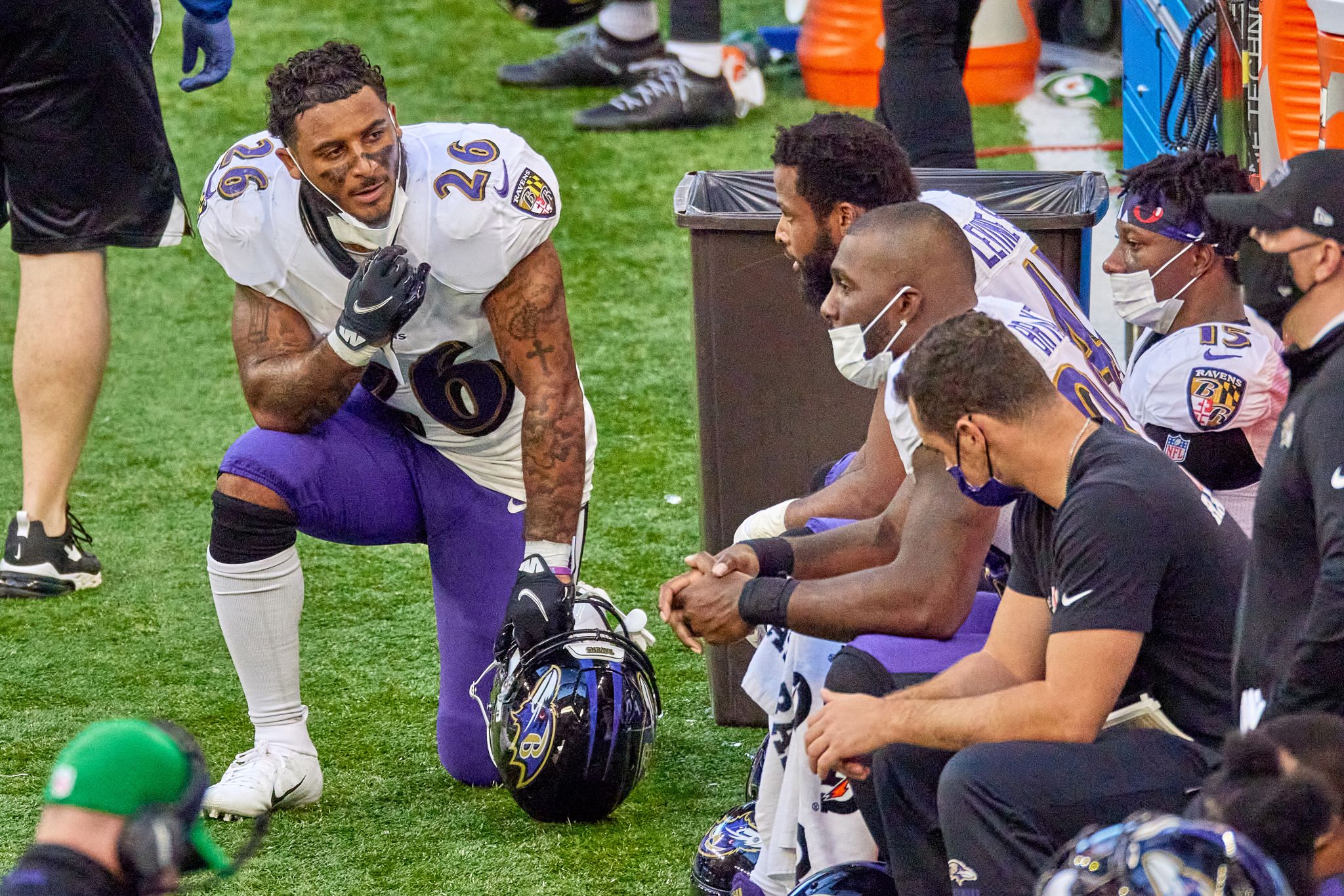 Baltimore Ravens safety Geno Stone (26) warms up before an NFL