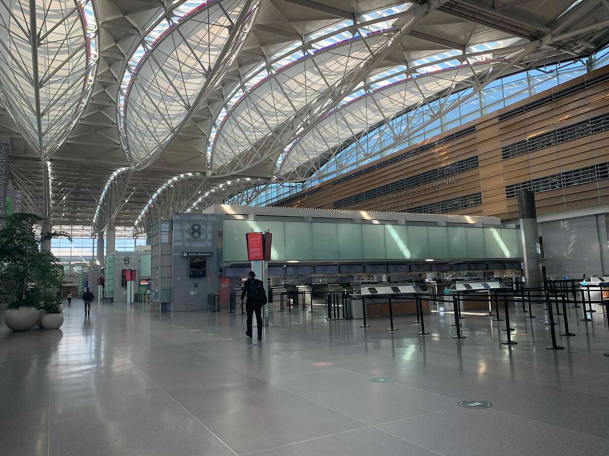 The departures hall at San Francisco International Airport’s Terminal A is desolate on Dec. 29, during what would normally be a bustling time for travel.